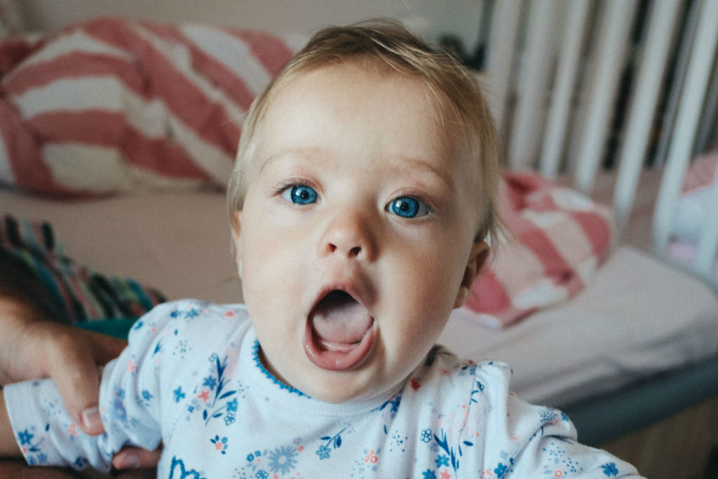 toddler with mouth open looking like she is about to scream