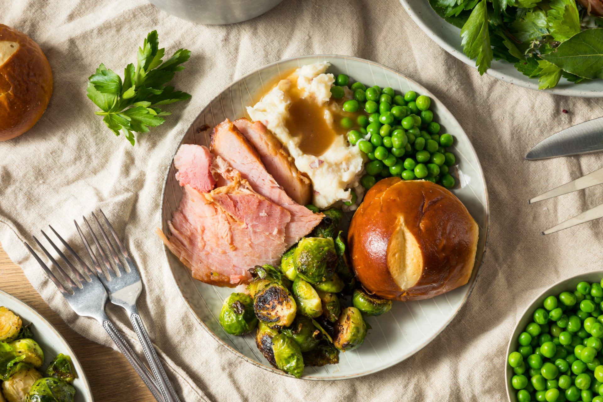 Ham, mashed potatoes and veg on a plate