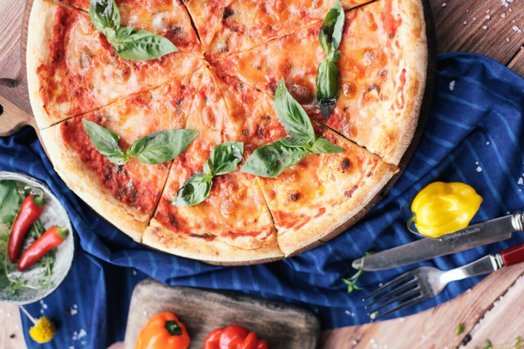 Gluten-free pizza dough has been made into a cheesy pizza