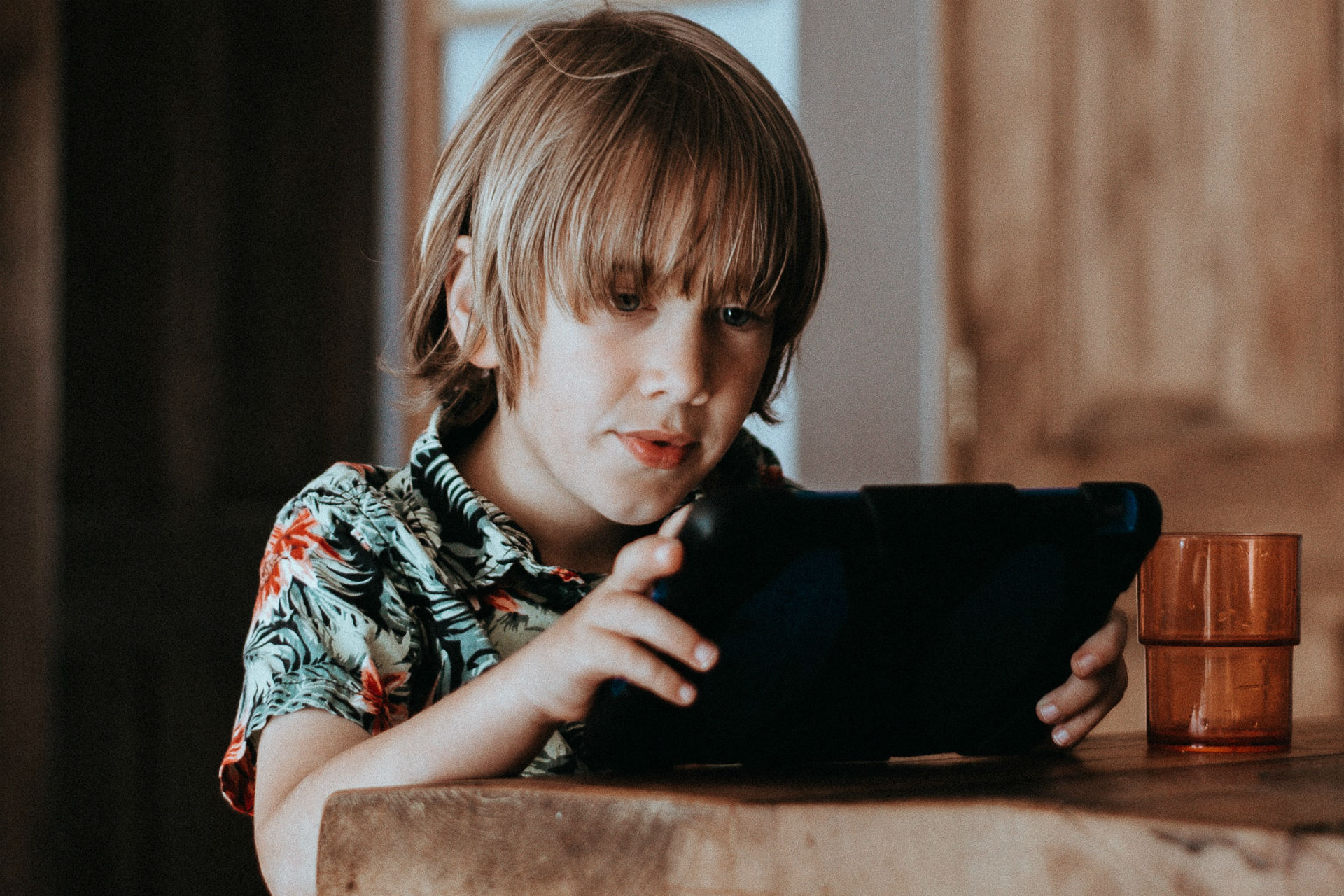 boy on a tablet enjoying screen time