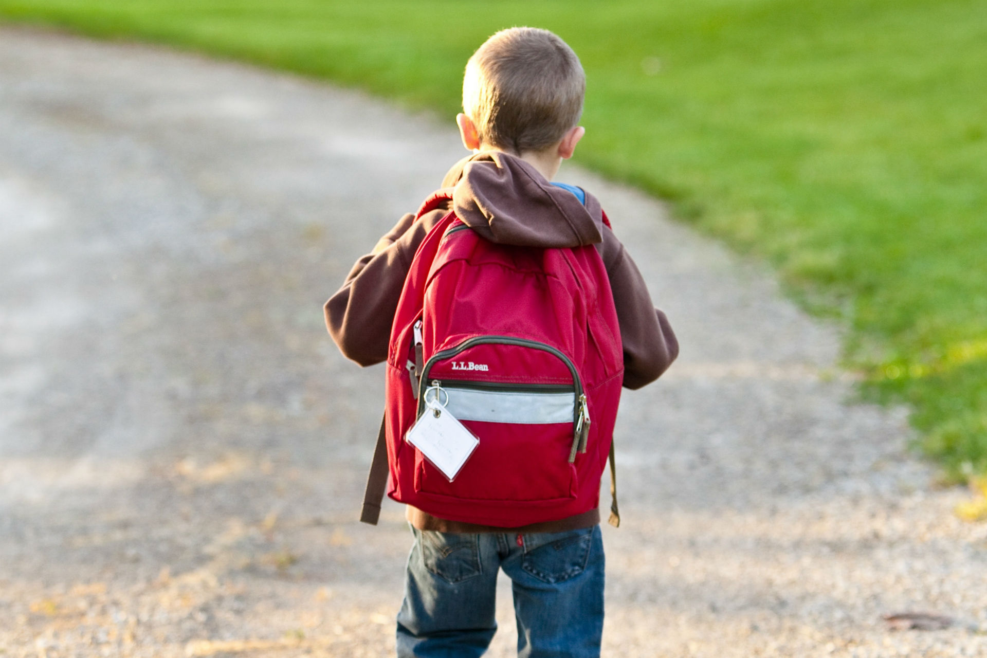 kid wearing a red backpack
