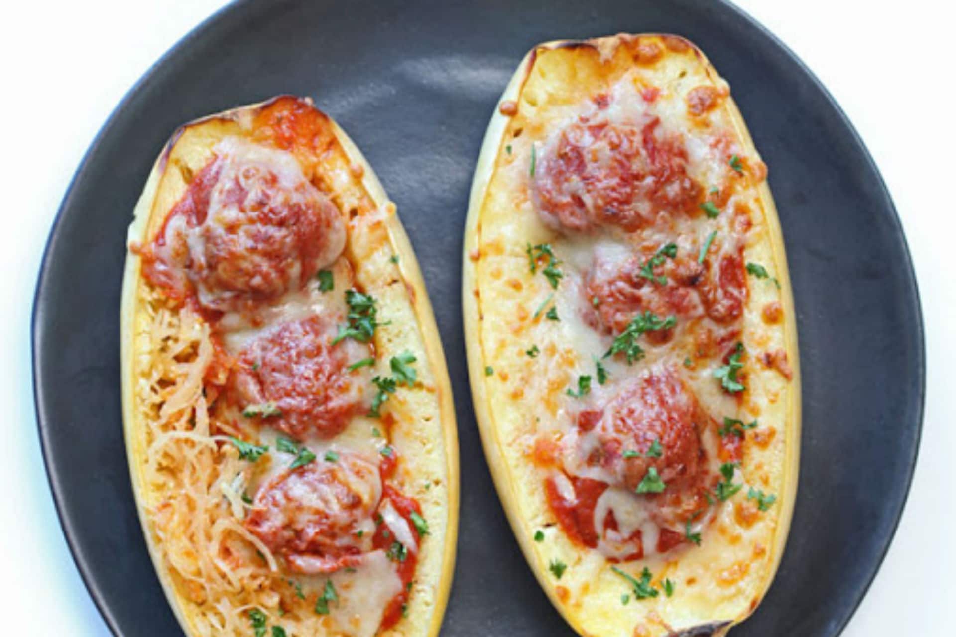 plate of spaghetti squash filled with tomato sauce and meatballs