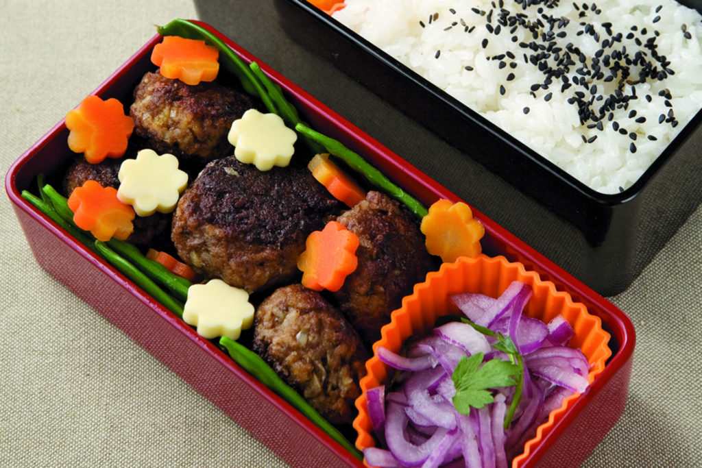 bento box with mini hamburger meatballs, rice, veggies