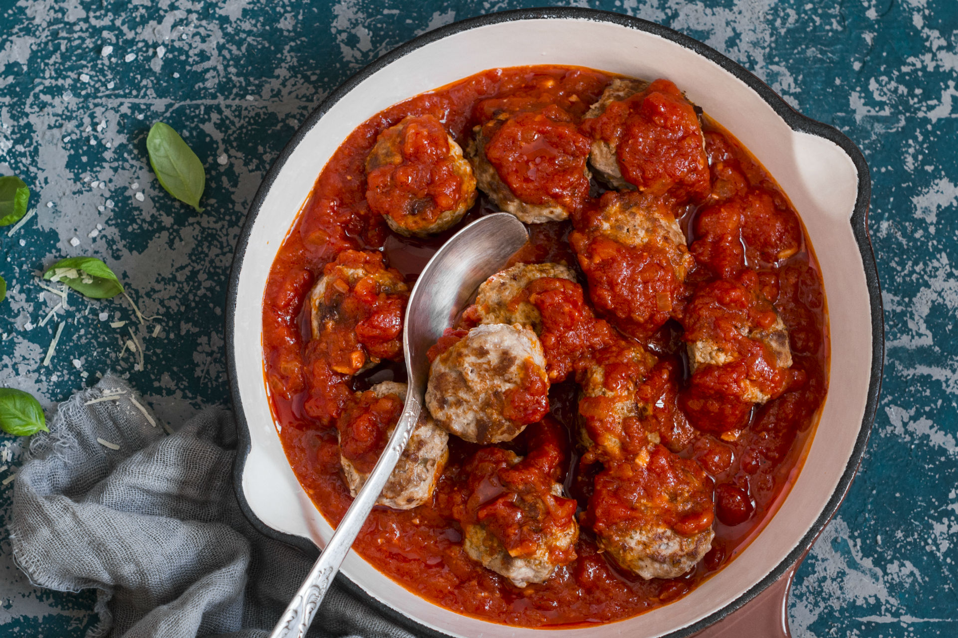 Pan of meatballs and sauce simmering