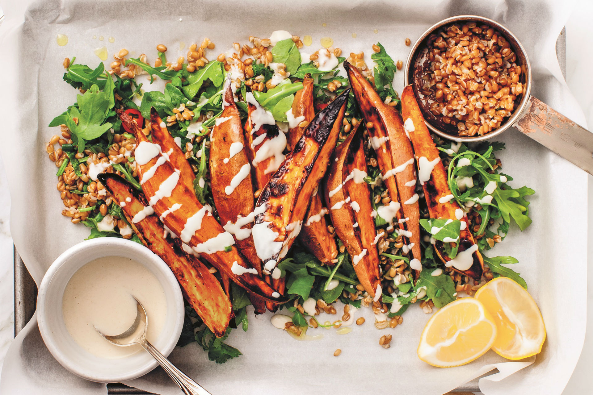 sweet potato fries on herbed grains with arugula