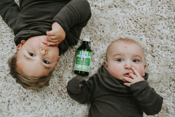 Two children with Homeocan Day Syrup