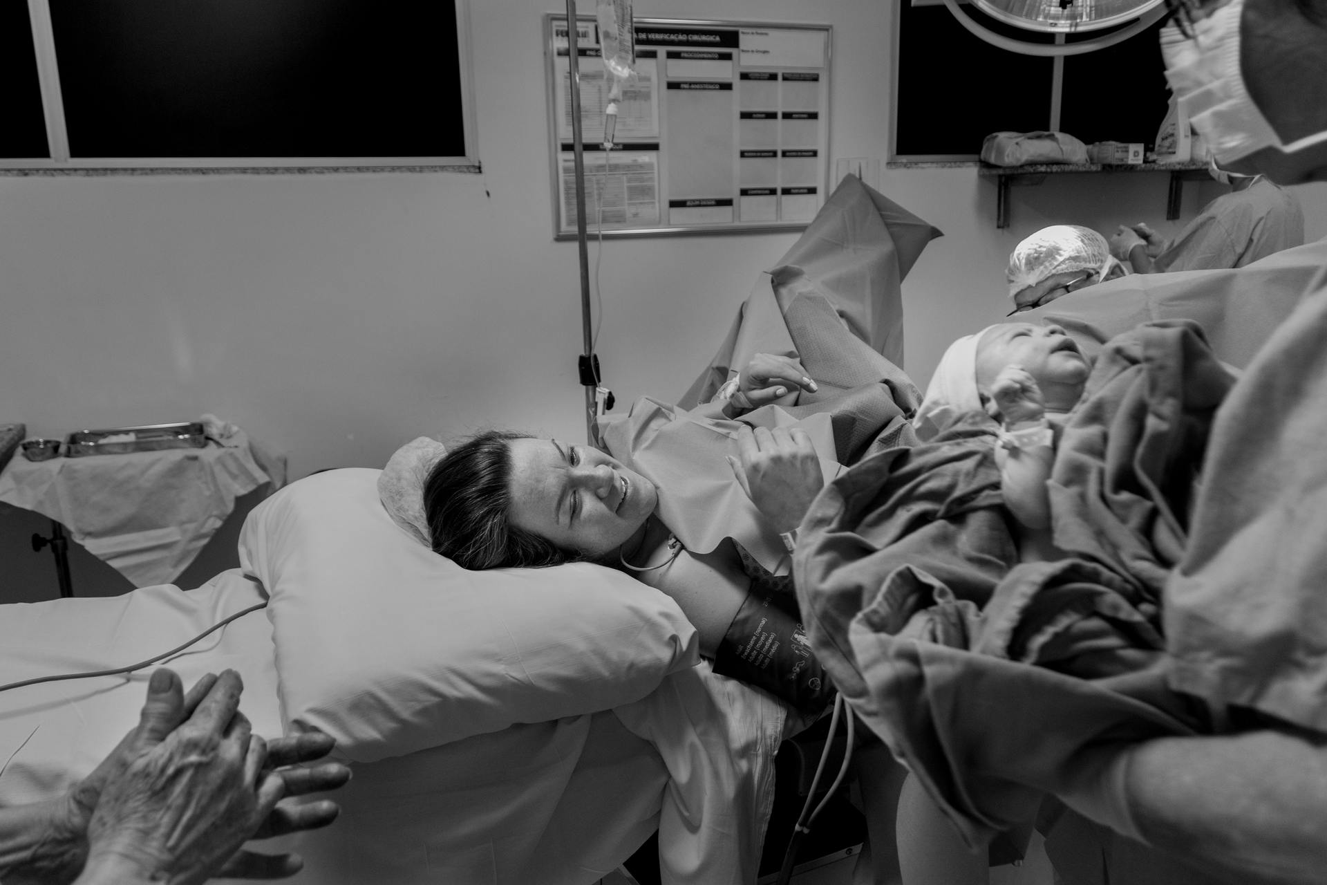 Black-and-white image of woman in delivery room