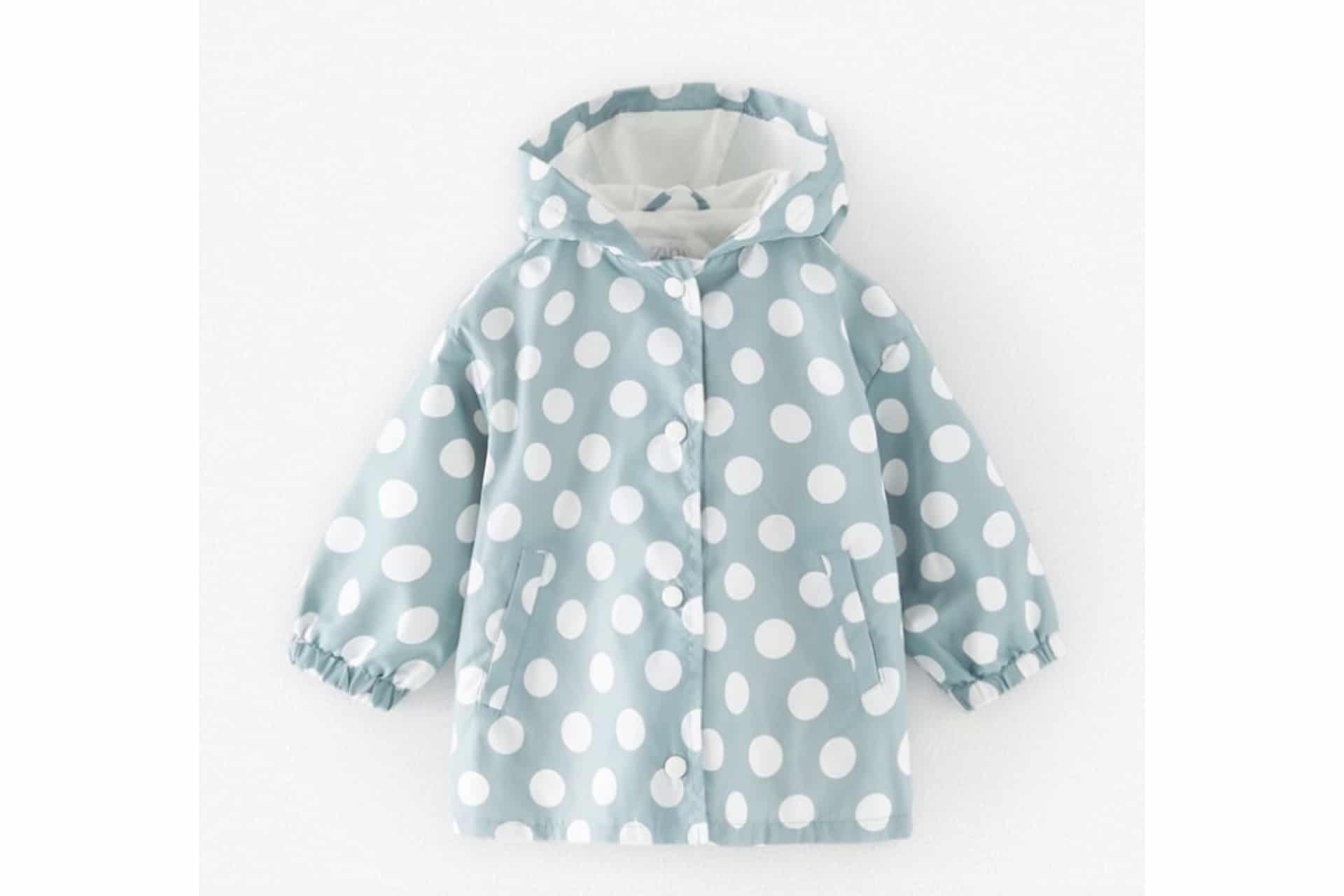blue and white polka dot rain jacket