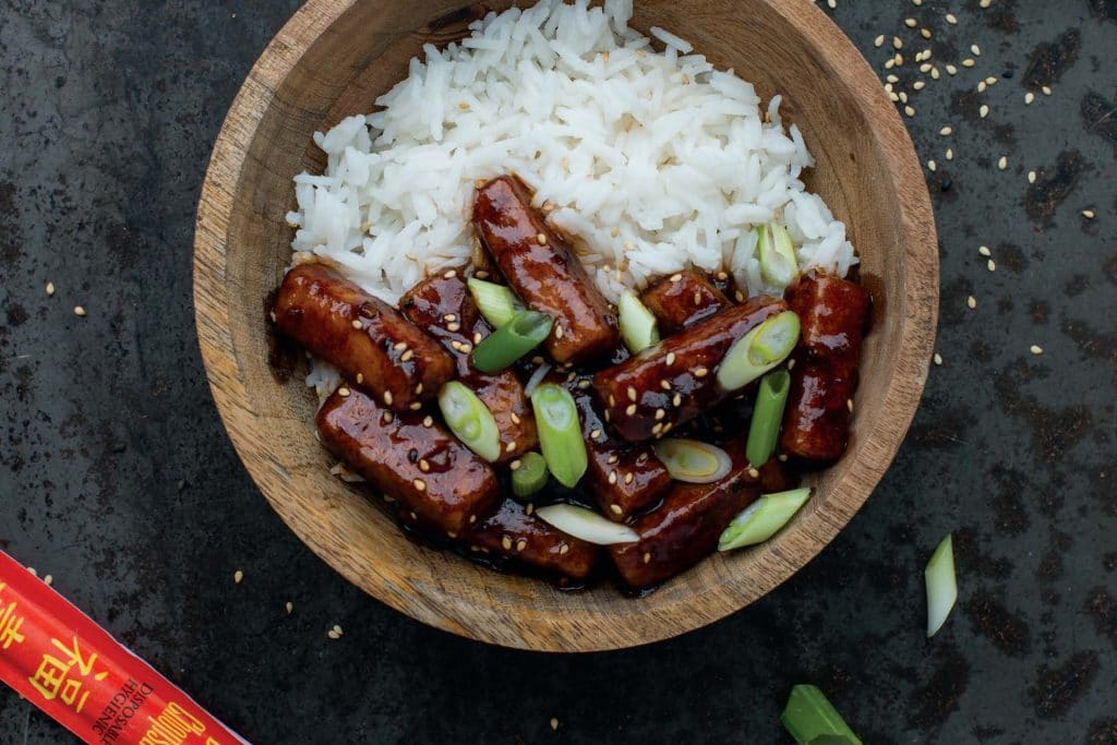 Bowl of saucy tofu over a bed of rice