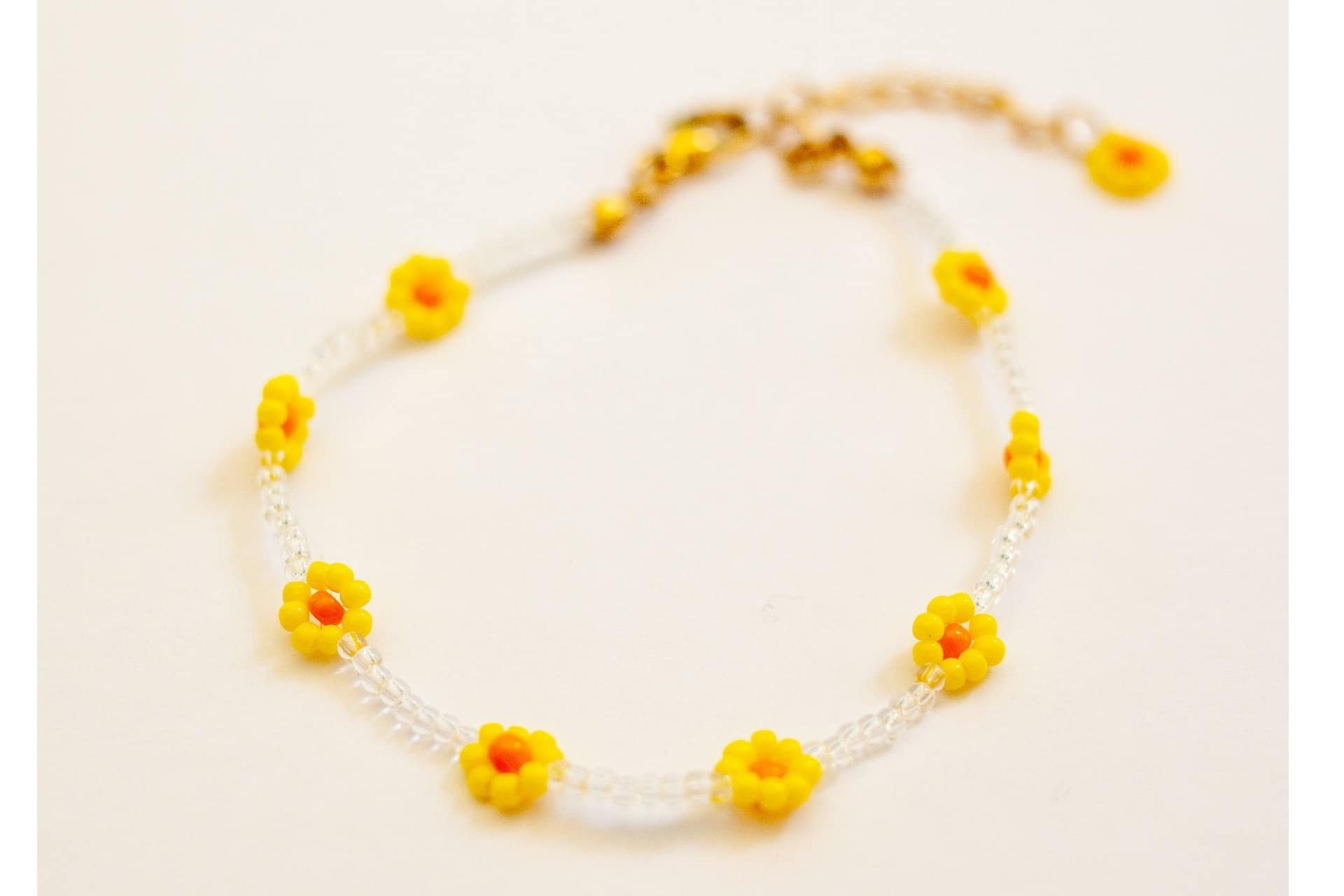 dainty beaded bracelet with yellow flowers