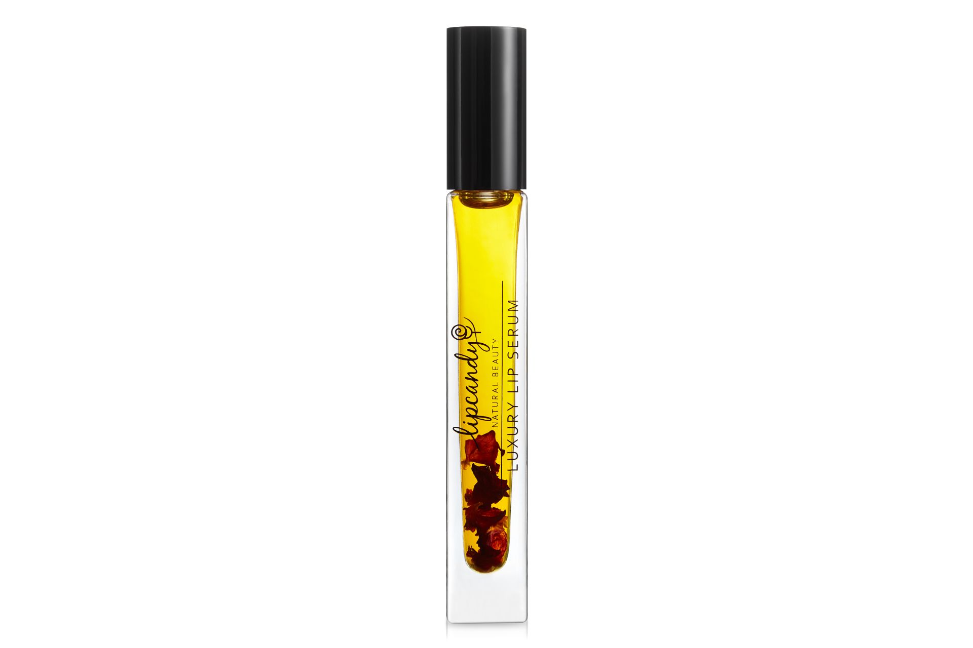 yellow serum in a roll-on with rose petals in the bottom
