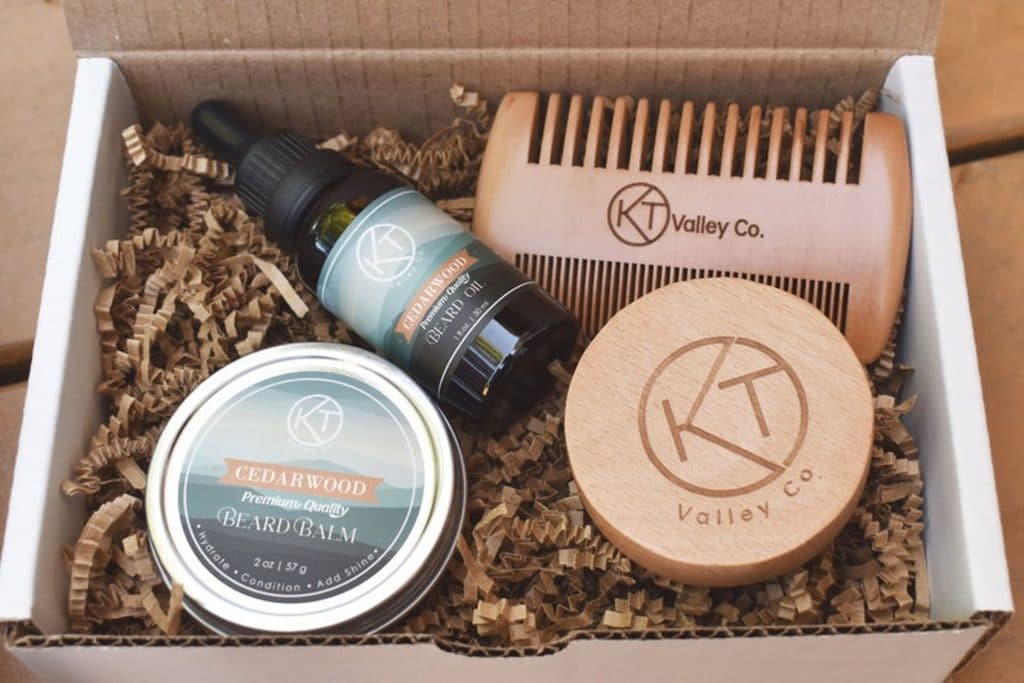 beard grooming kit including oil, balm and two brushes