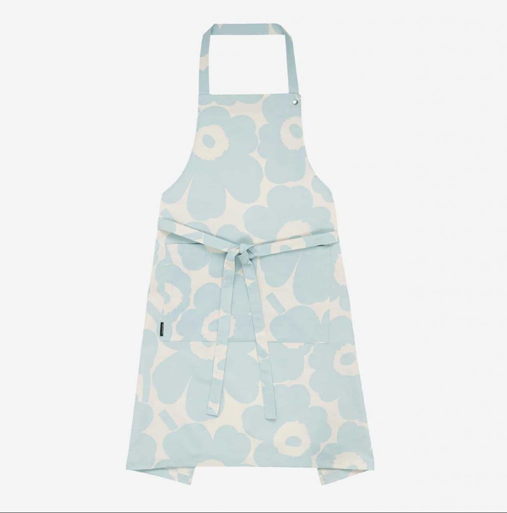light blue and white apron with large, graphic poppies