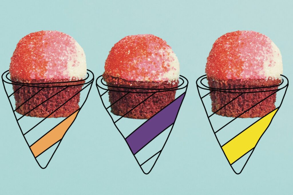 Sprinkle-topped red velvet cupcakes with illustrated cones